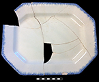 Edged refined white earthenware octagonal dish.  Impressed “13” on reverse.  Measurements:  14.5” x 11”, from 18BC27, Feature 30.